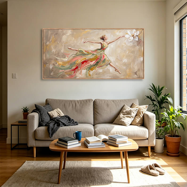 Large horizontal hand-painted ballerina dancer wall art displayed above a light gray sofa in bright natural light