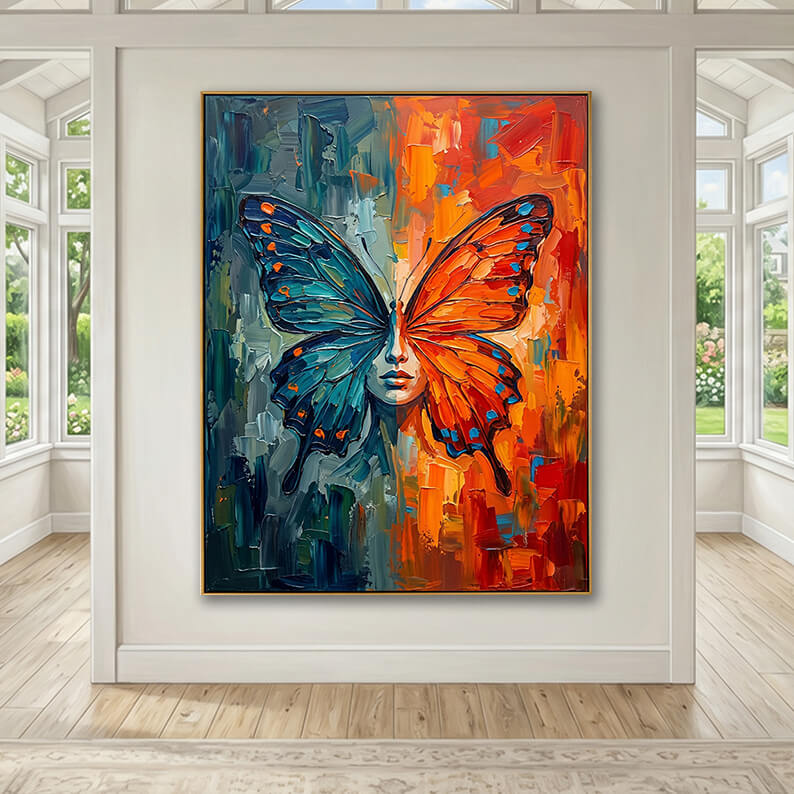 Vibrant split-color abstract butterfly face canvas art hung in a bright, modern sunroom with large windows and hardwood floors.
