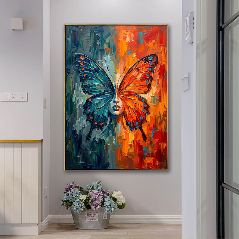 Large textured abstract butterfly canvas wall art featured in a modern home entryway beside a rustic bucket of hydrangea flowers.