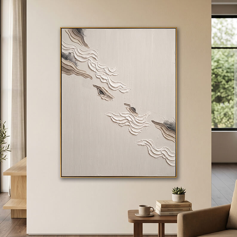 Minimalist hand-painted impasto canvas art hanging above a wooden side table in a cozy beige and neutral living space.