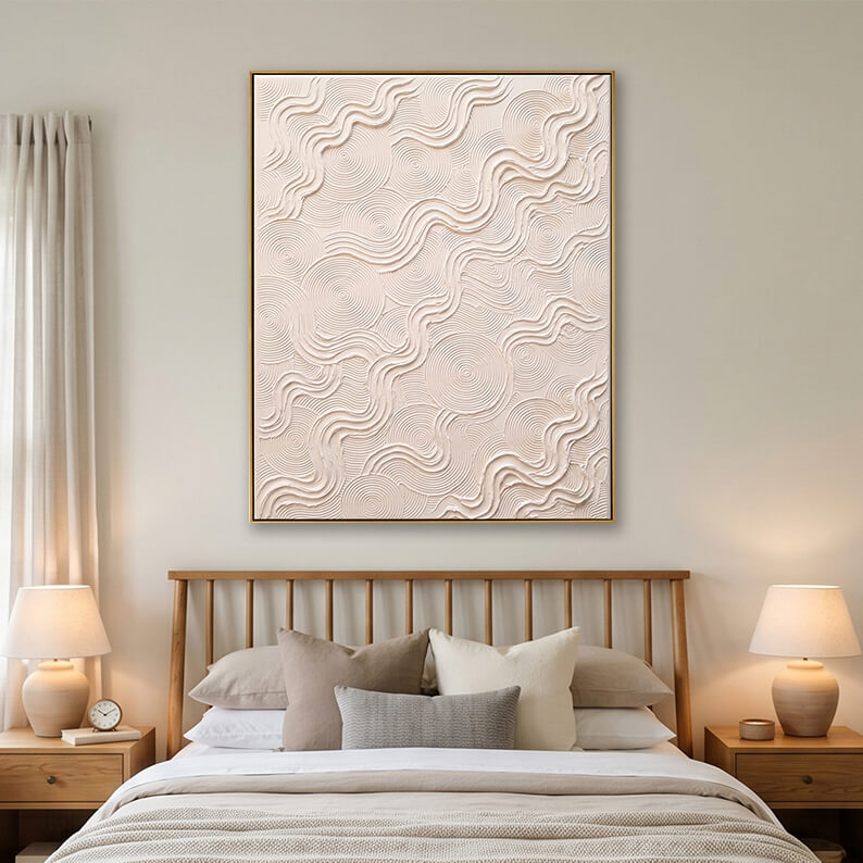 Large textured white abstract canvas art hanging above a modern wooden bed in a neutral, minimalist bedroom setting.