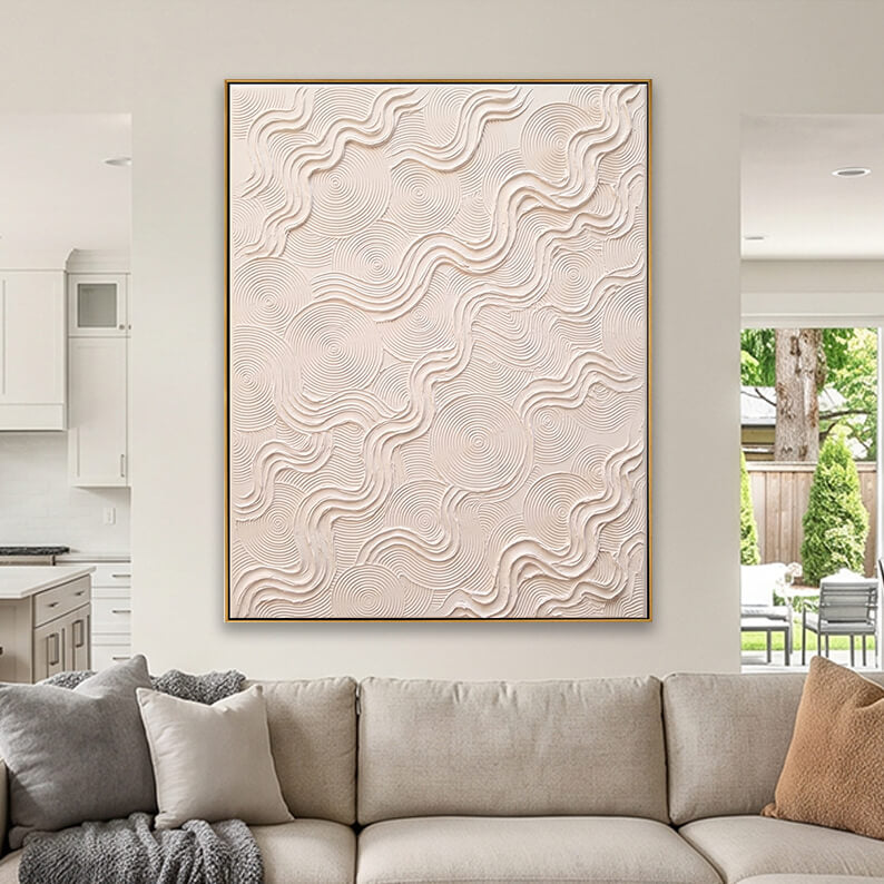 Elegant textured neutral abstract painting styled beautifully above a light beige sofa in a modern living room.