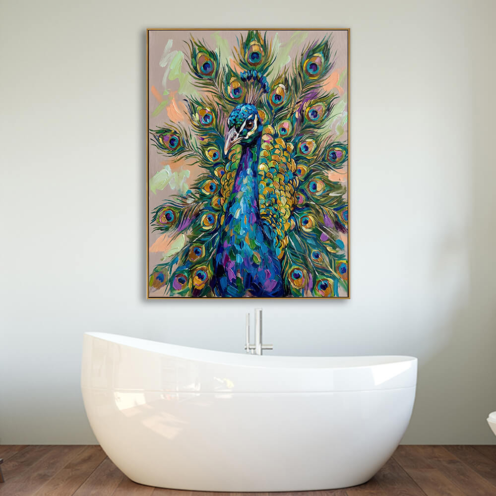 The colorful peacock canvas print is styled as a statement piece on a clean, light gray bathroom wall. It is positioned directly behind a sleek, freestanding white acrylic oval bathtub with a minimalist vertical silver floor-mount faucet. The floor is made of rich, warm wooden planks, creating a tranquil, spa-like atmosphere where the vibrant artwork provides a beautiful pop of color.