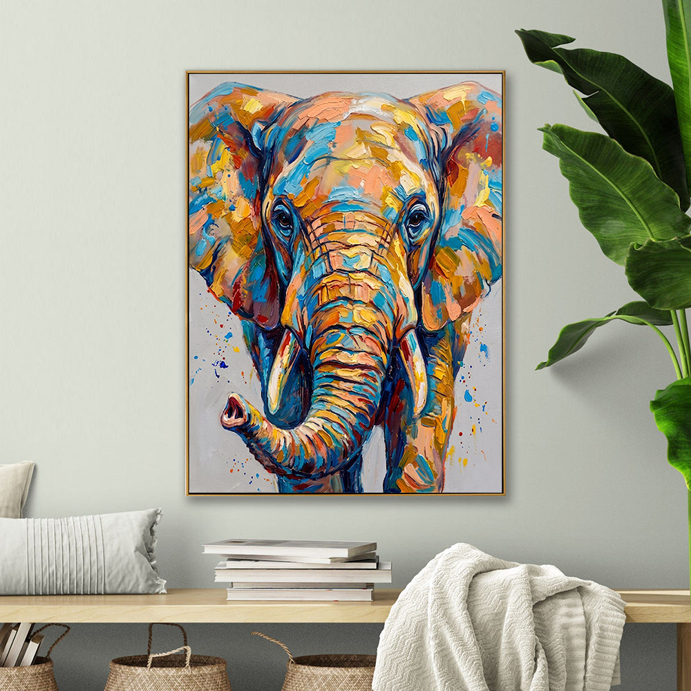 Modern abstract elephant painting shown in a bright living room setting next to a large tropical green plant.