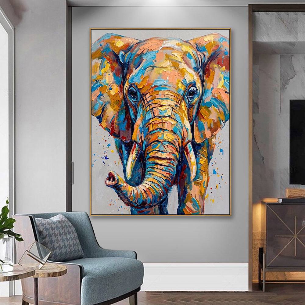 Vibrant multicolored elephant wall art hung in a contemporary living space alongside a blue velvet armchair.
