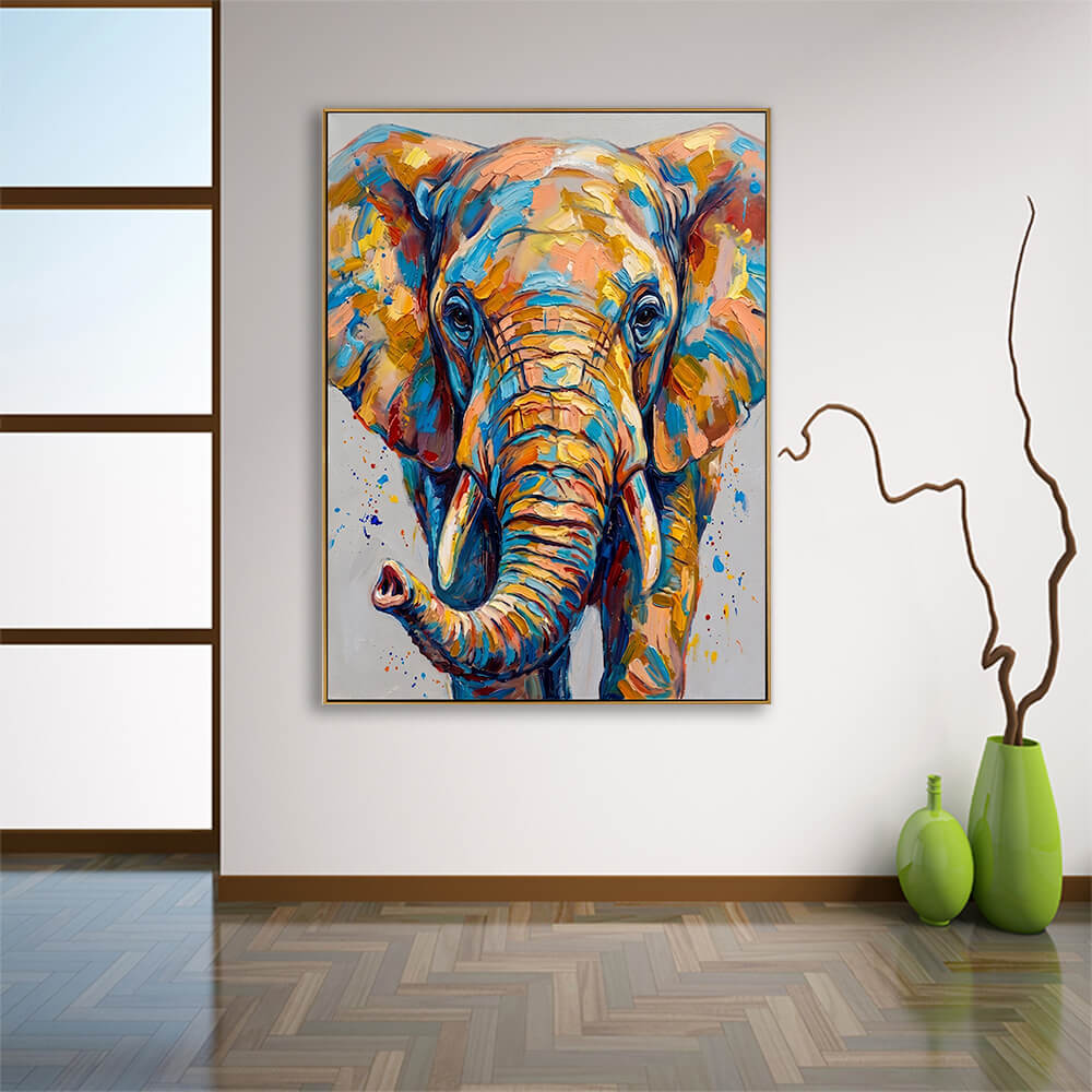 The vibrant elephant oil painting displayed on a stark white wall in a modern room with a glossy wood herringbone pattern floor. To the left is a tall window with dark wooden frame panes, and to the right, a pair of bright green ceramic vases—one tall holding long, winding decorative branches, and one smaller matching vase.