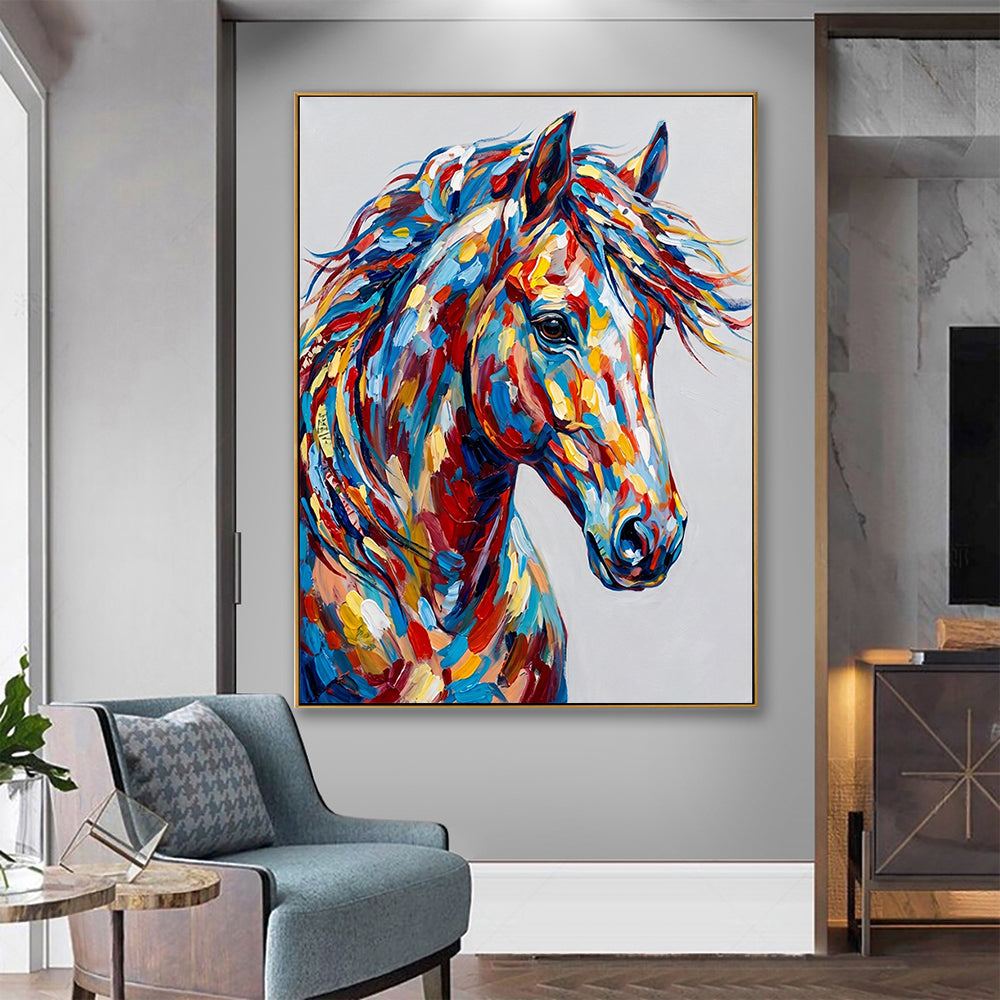 Large abstract horse head painting in a minimalist interior design next to a blue armchair.