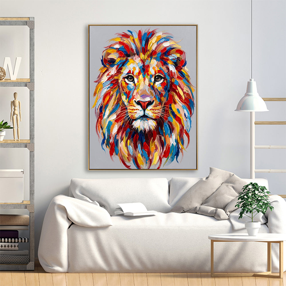 Large colorful lion canvas art hanging in a bright, airy living room above a white fabric sofa.