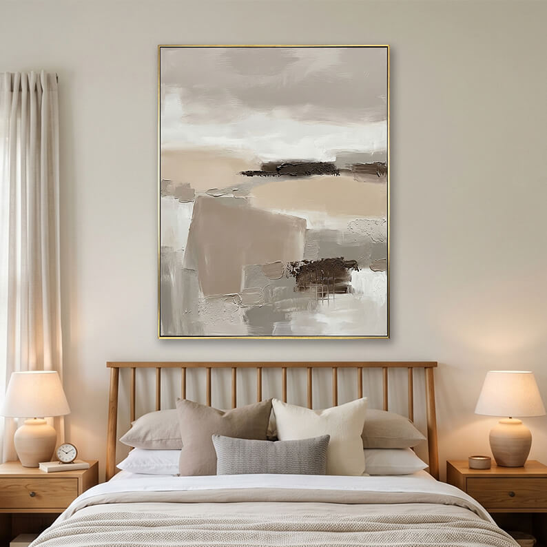 Beige abstract landscape painting hanging over a wooden bed in a bright modern bedroom.