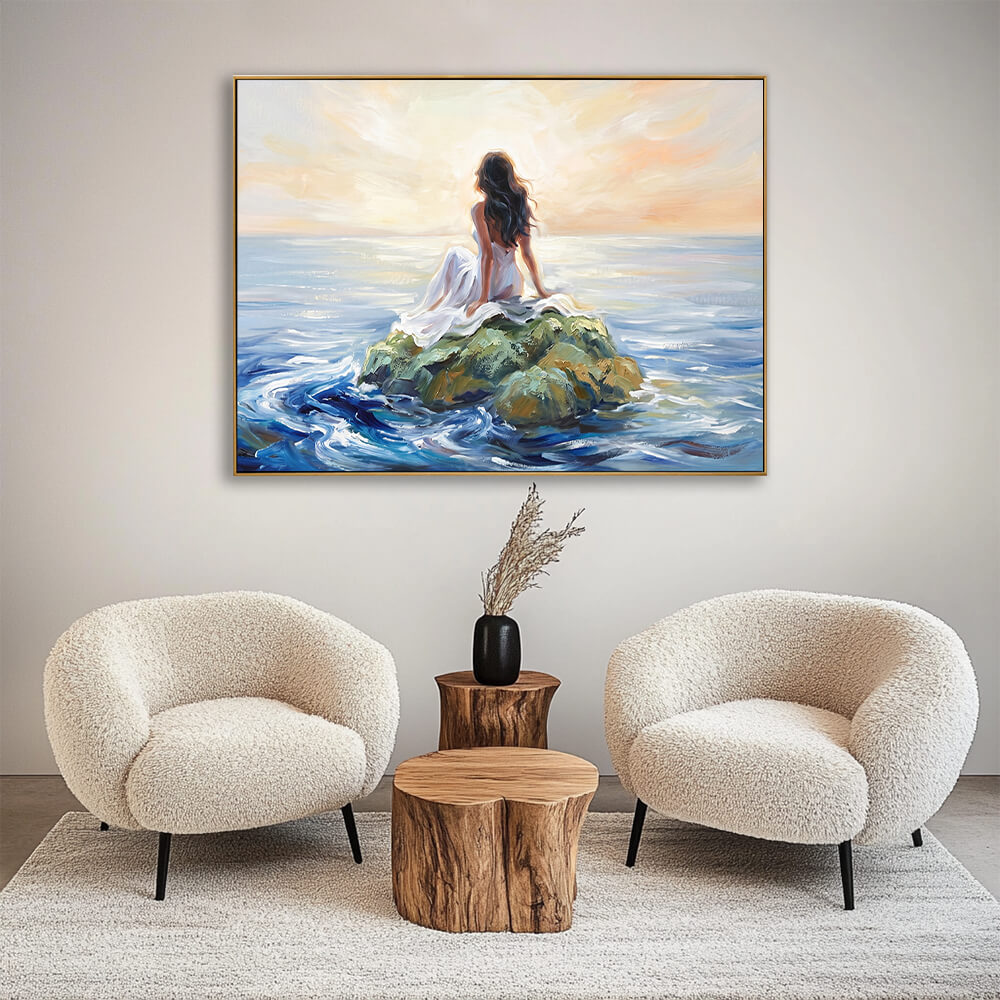 Peaceful hand-painted seascape canvas hanging above light grey fabric sofa in soft neutral living room