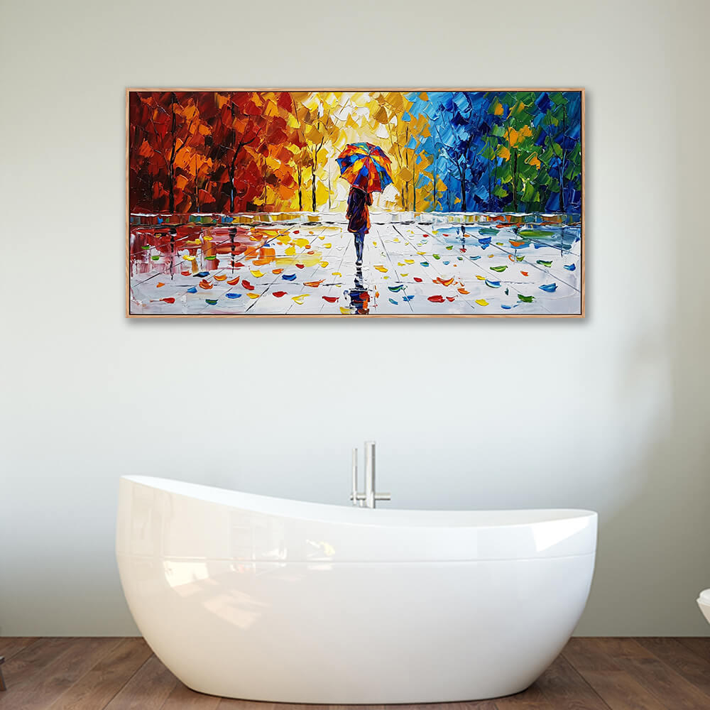 Large panoramic textured rainy landscape painting with red and blue trees decorating the wall above a modern freestanding white bathtub.