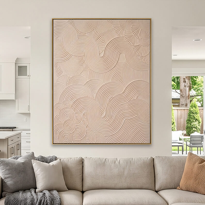 Wabi sabi style neutral textured canvas art hanging above a beige sofa