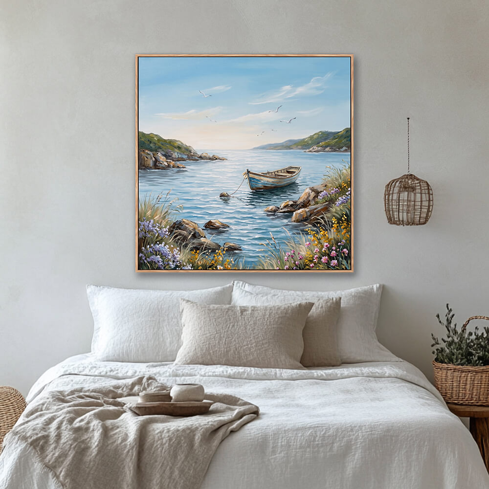 Serene coastal wildflower boat landscape wall art above linen bed in cozy bedroom