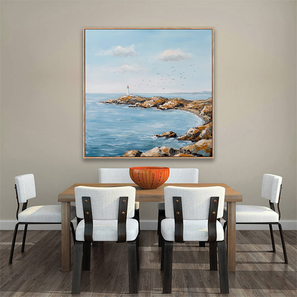 Calm rocky bay lighthouse hand-painted canvas decor above solid wooden dining table