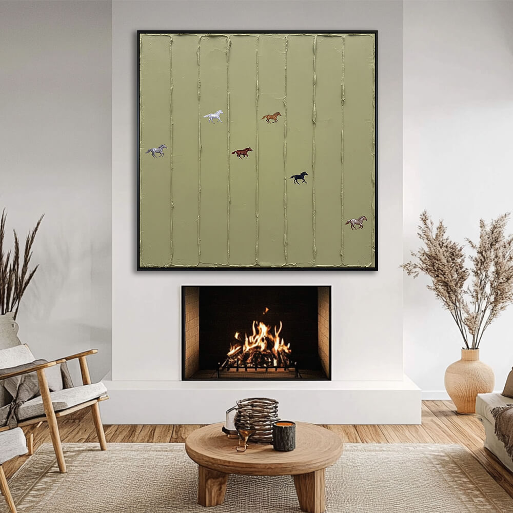 Interior styling view of Wild Meadow Run hanging above a glowing fireplace in a cozy, cream-toned living room.