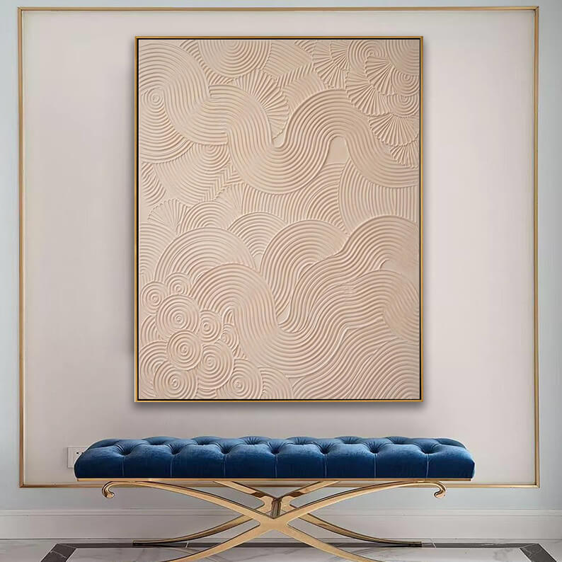 Sculptural 3D impasto wave painting featured above a blue velvet bench in an elegant hallway.