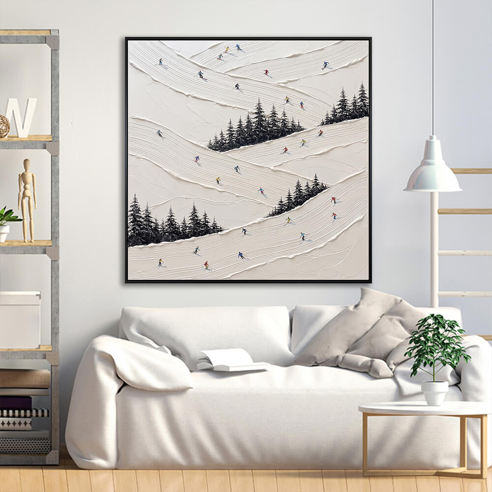 Interior styling view of Snowy Slalom frosty mountain trails canvas decor hanging in a contemporary living room above a neutral white sofa with decorative pillows.