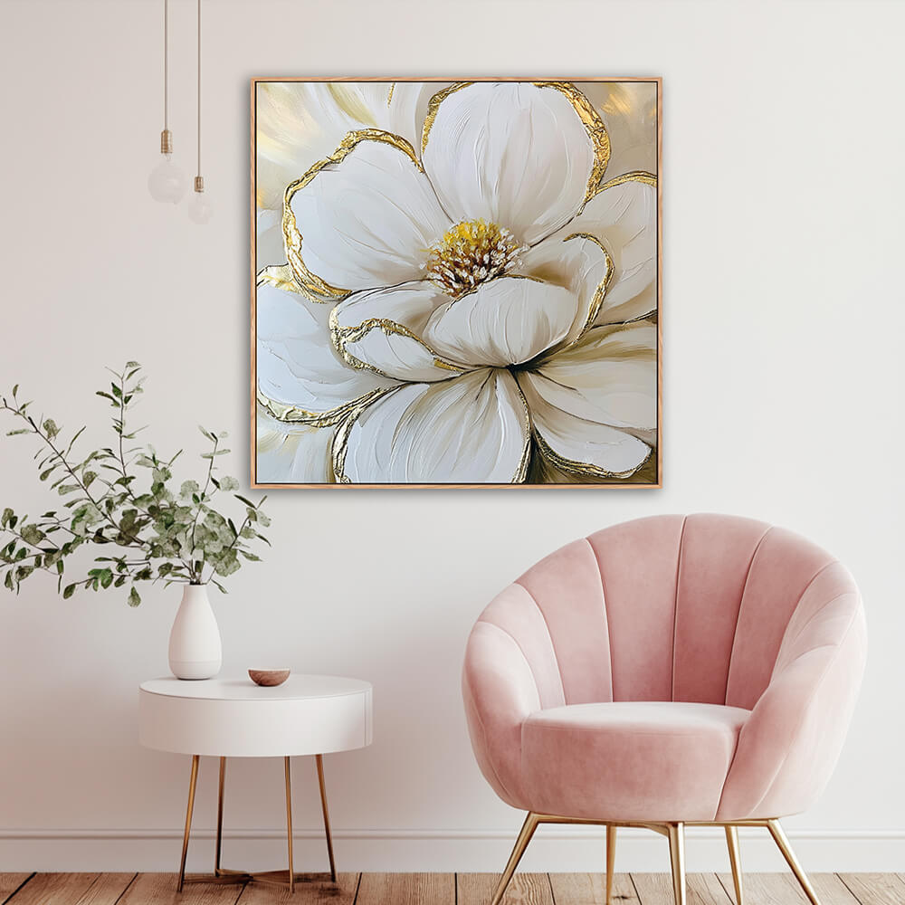 Hand-painted white magnolia gold leaf canvas in cozy reading nook with blush pink velvet armchair, white round side table and eucalyptus greenery vase