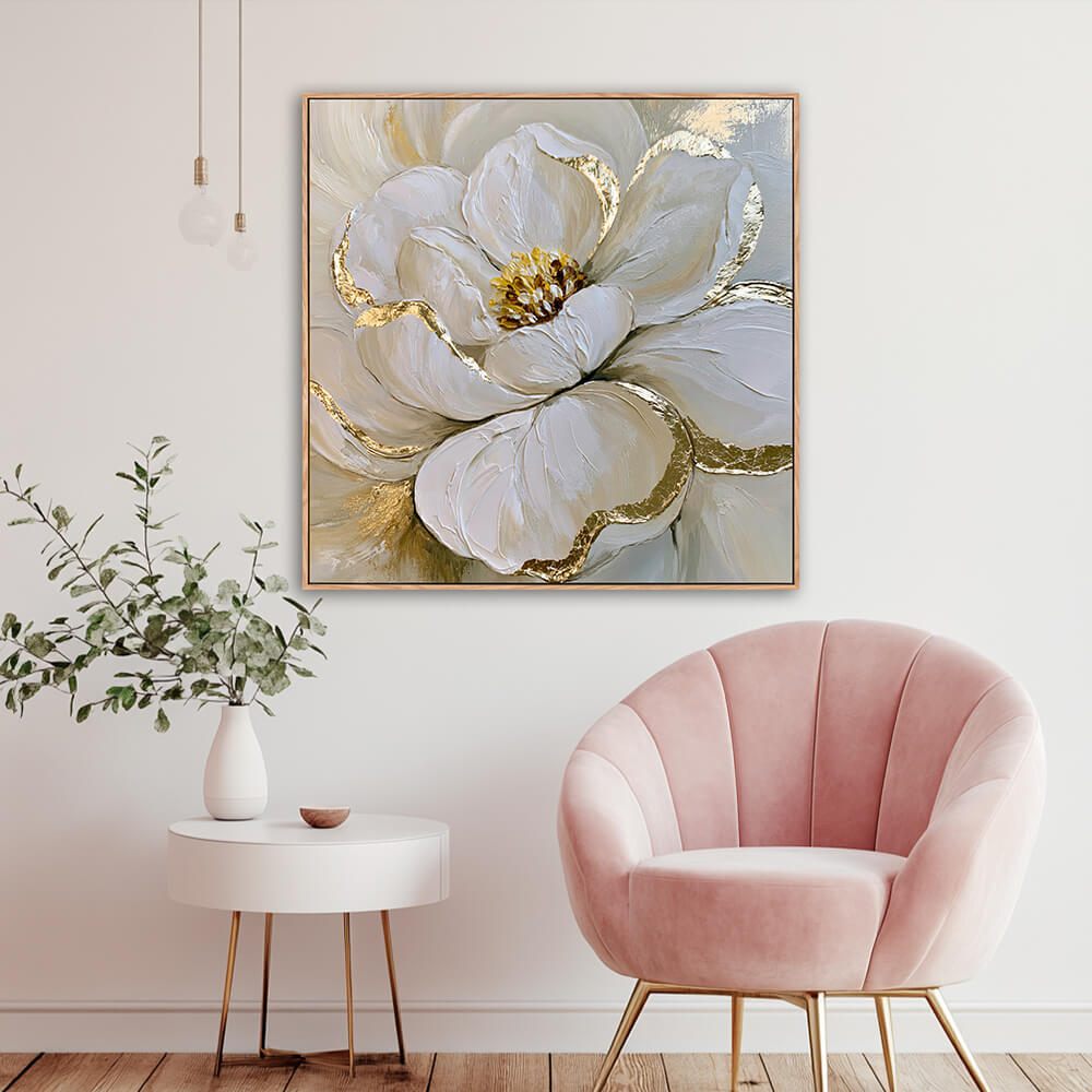 Hand-painted white peony gold leaf canvas in cozy reading nook with blush pink velvet armchair, white round side table and eucalyptus greenery vase