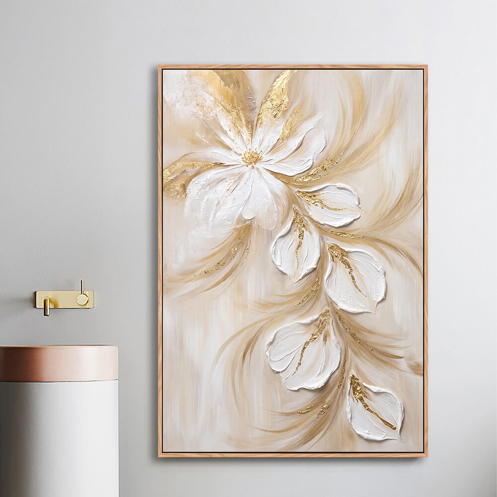 Bathroom vanity display, textured thick paint white trailing flower canvas with gold leaf veins, warm beige backdrop, palette knife artwork