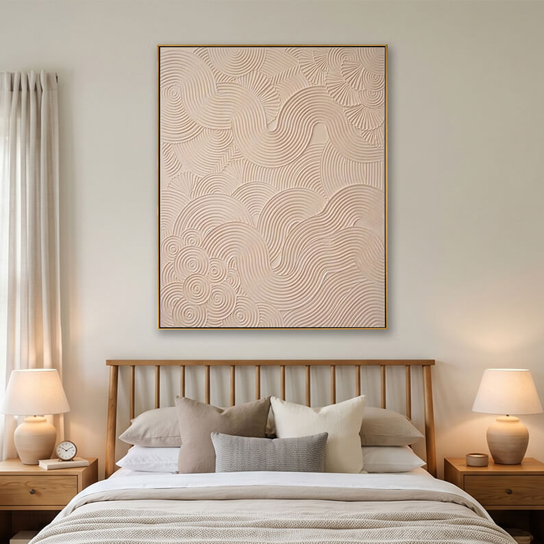Beige heavy texture swirl wave painting hanging over a wooden bed in a bright modern bedroom.