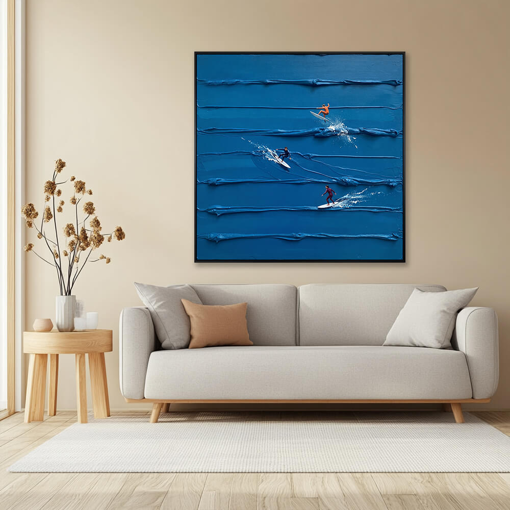 Interior styling view of Azure Surf Break hanging in a minimalist living room above a beige sofa with a round side table and dried flowers.