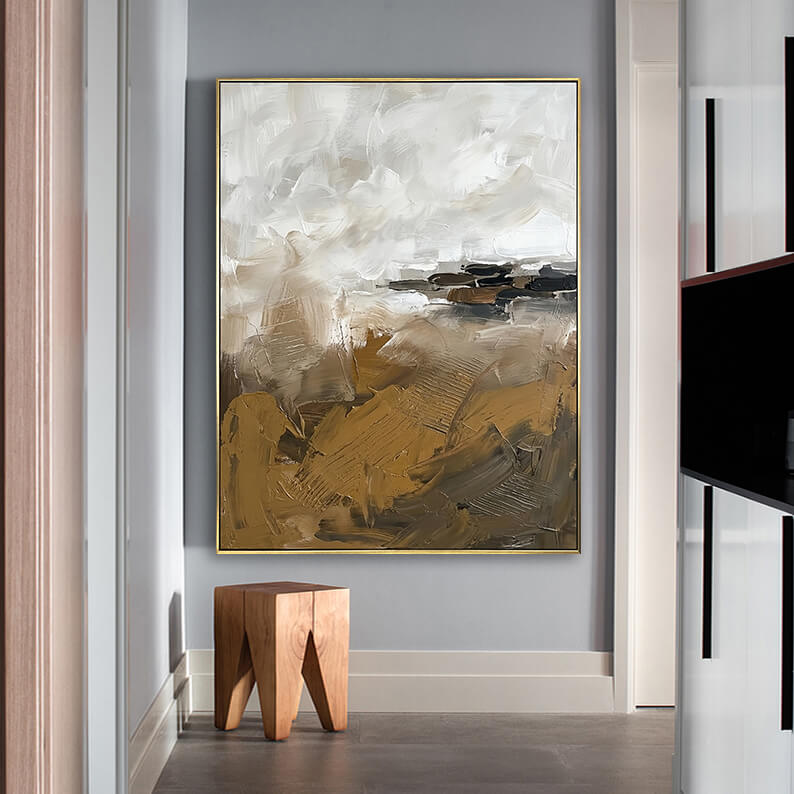 Abstract geometric 3D texture painting hanging above a geometric wooden stool in a minimalist modern hallway.