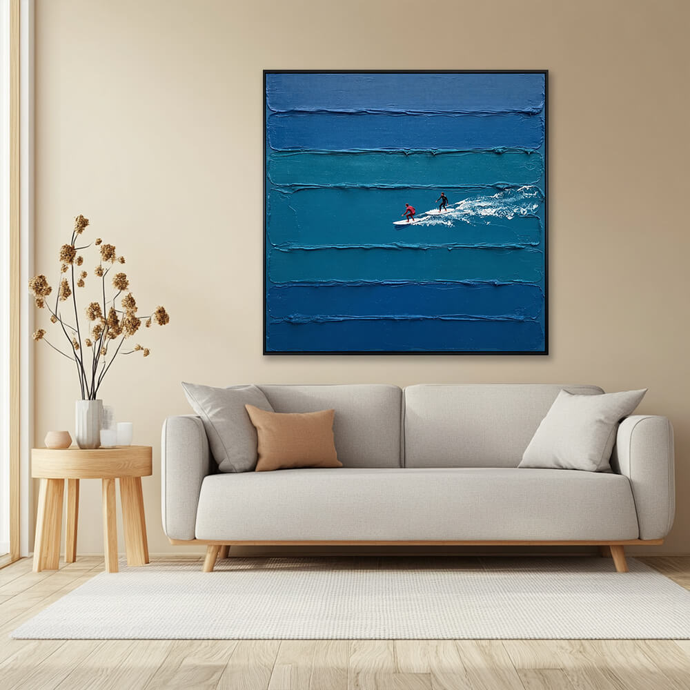 Interior styling view of Coastal Glide hanging in a minimalist living room above a beige sofa with a round side table and dried flowers.