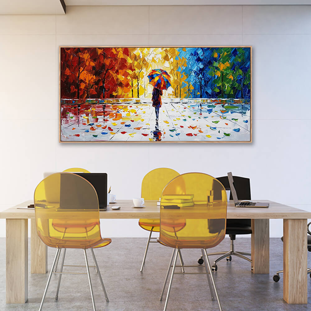 Wide horizontal impressionist autumn forest canvas painting displayed in a minimalist home office setup with yellow translucent chairs.