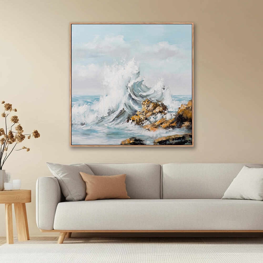Textured crashing ocean wave rocky shore seascape painting in warm neutral farmhouse living room