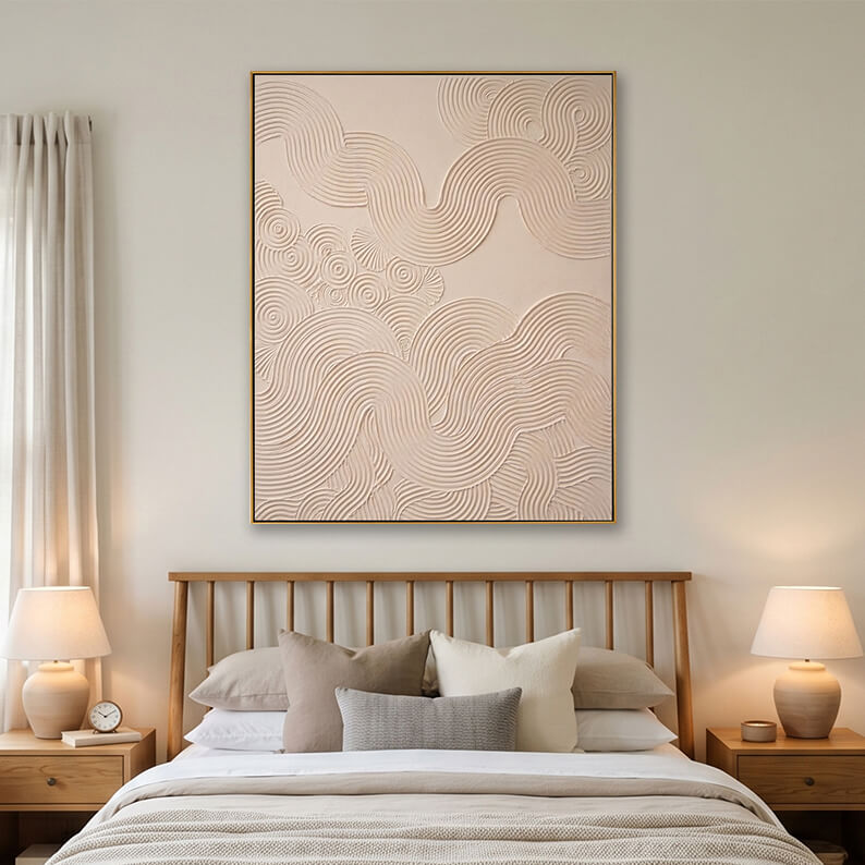 Beige heavy texture swirl wave painting hanging over a wooden bed in a bright modern bedroom.