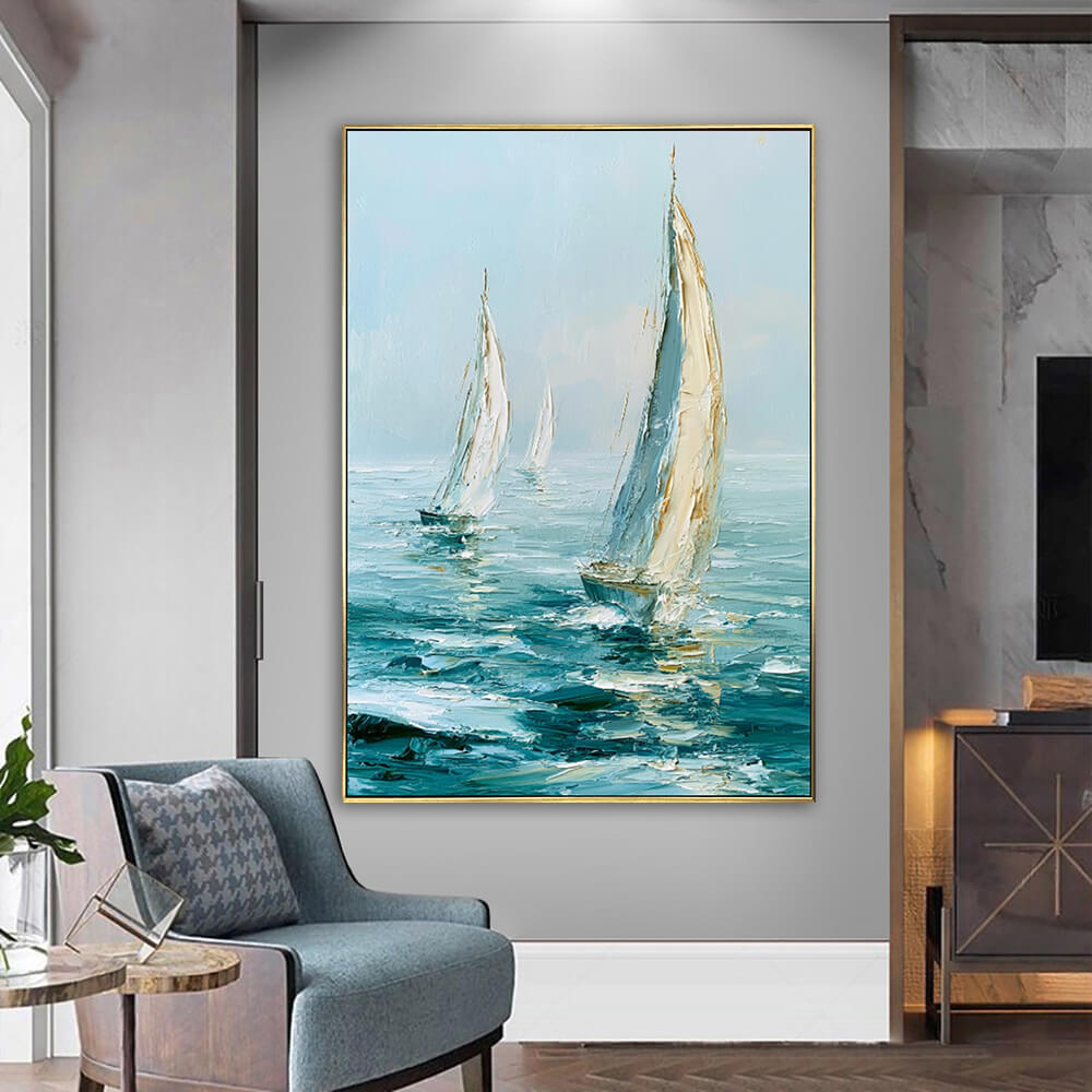 Bright living room corner, framed Ocean Sail Drift textured seascape painting above blue accent armchair, coastal modern home styling