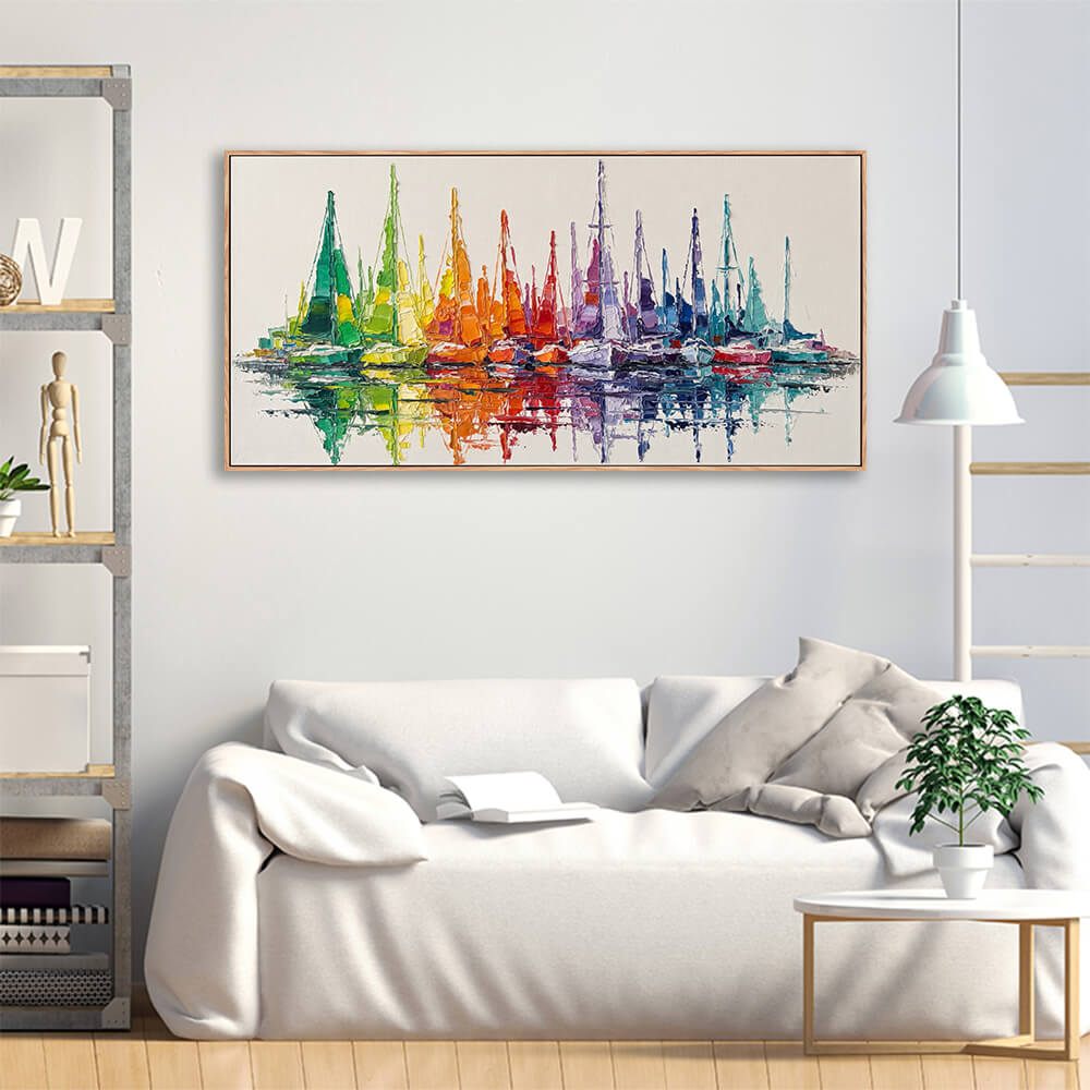 Vibrant sailboat reflection hand painted canvas hung above plush linen sofa for casual living room decoration