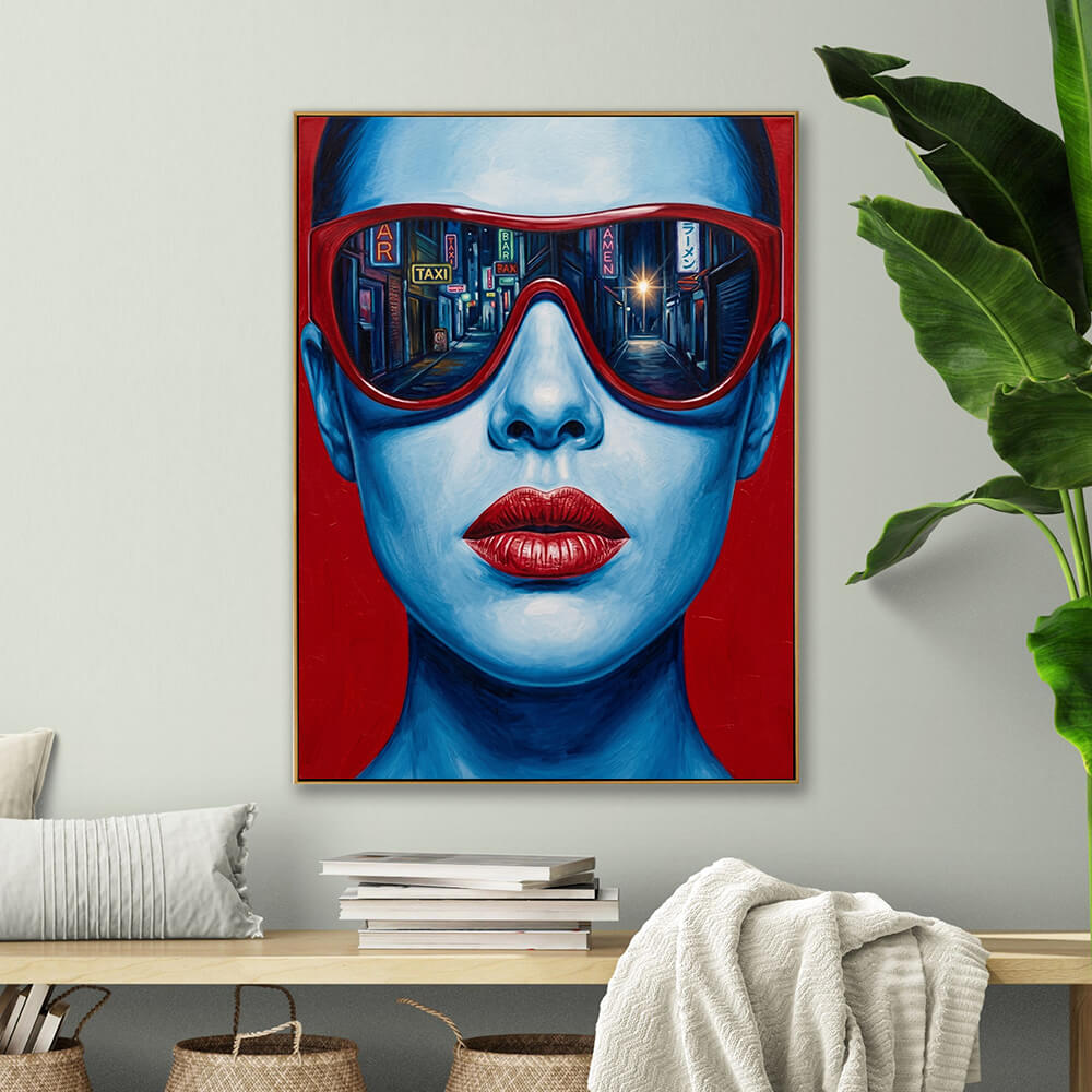 Hand-painted urban pop art canvas displayed above natural wooden low shelf, paired with green tropical leaf plant and woven storage baskets in neutral modern living room