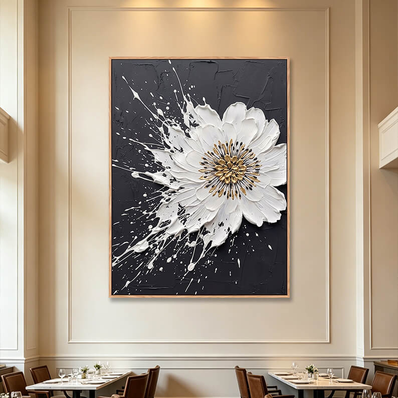 Large vertical 3D textured white splash flower painting on black background in fine dining restaurant, gold accented impasto canvas