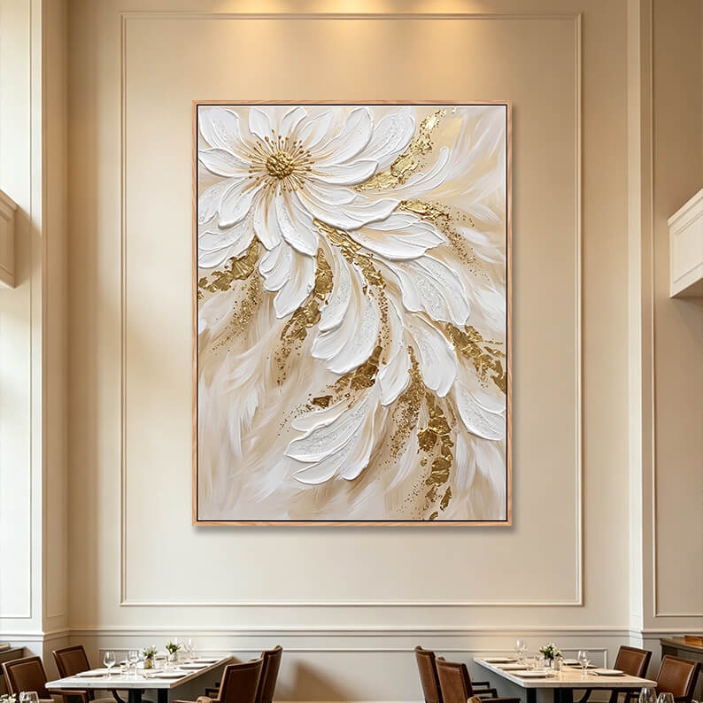 Large vertical 3D textured white flower cascade painting in fine dining restaurant, gold accented impasto canvas on elegant paneled wall