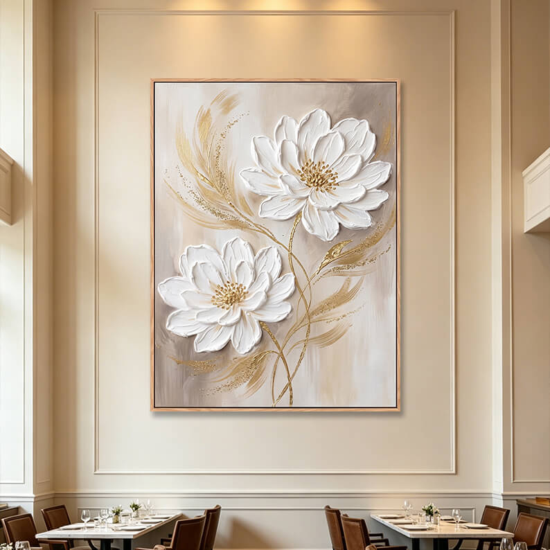 Large vertical 3D textured white flower painting in fine dining restaurant, gold and beige impasto canvas on elegant paneled wall