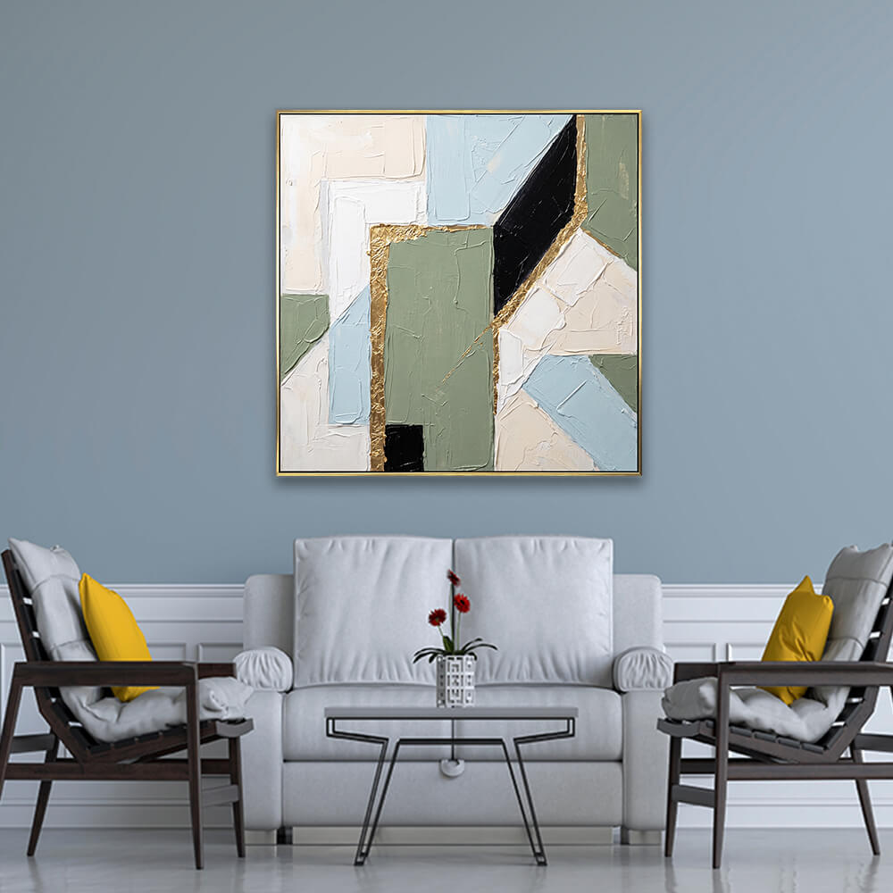 Refined angular gold foil geometric abstract artwork hanging on light grey formal living room wall