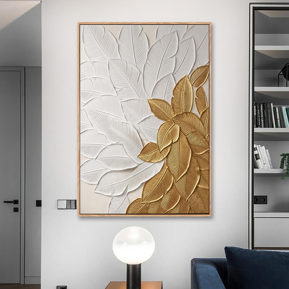 Contemporary living room feature wall, cream tone impasto tropical leaf artwork, contrasting white textured leaves and shimmering golden foliage