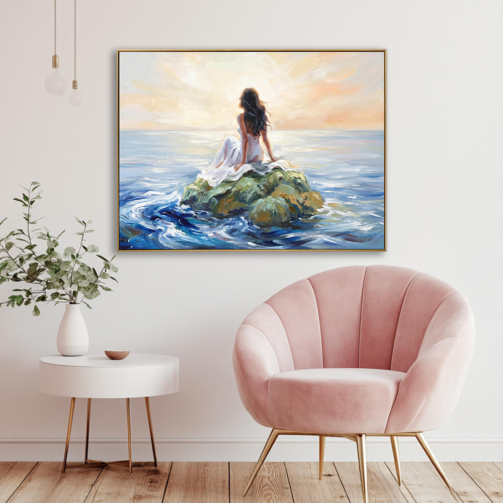 Hand-painted sunset seascape canvas in elegant lounge with blush pink velvet shell chair and gold metal legs