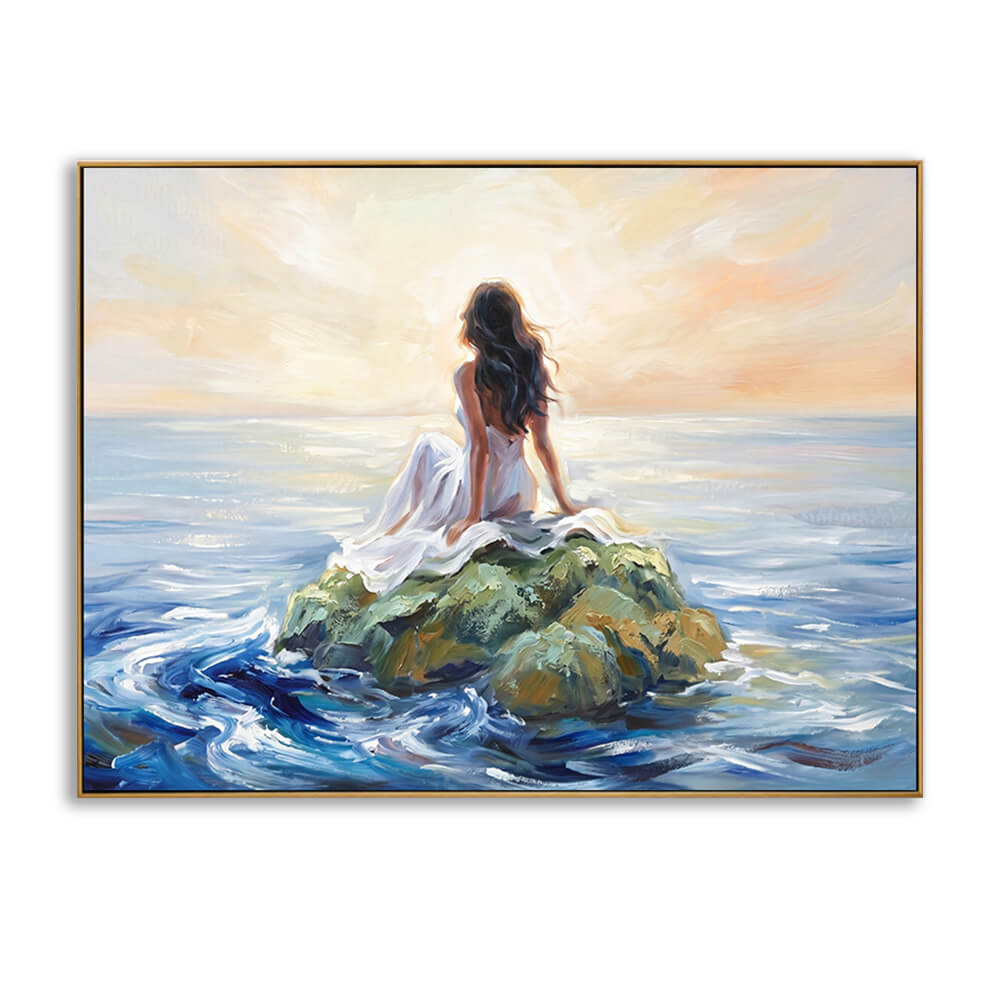 Hand-painted sunset ocean canvas wall art, back view woman in white dress on coastal rock, thick impasto texture, thin gold frame, isolated white background