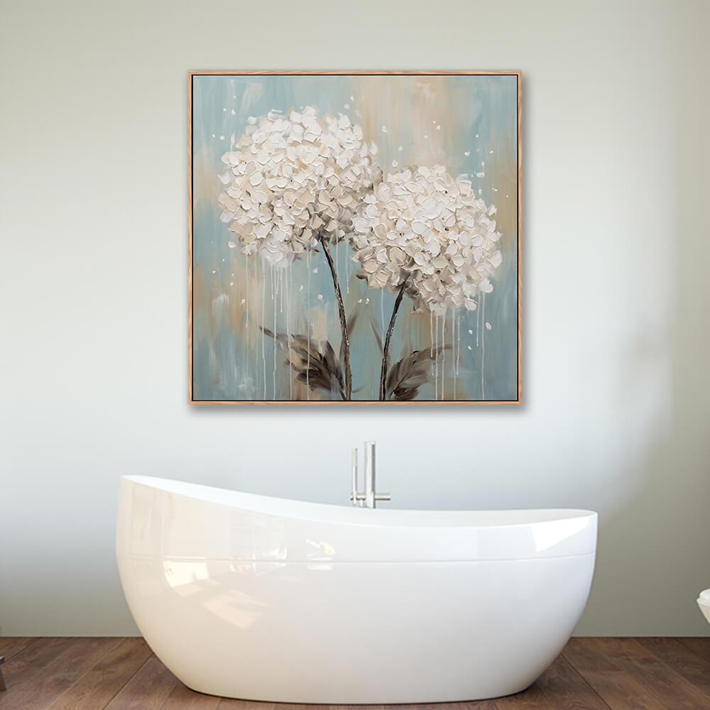 Framed white hydrangea textured painting above bathtub in modern bathroom interior