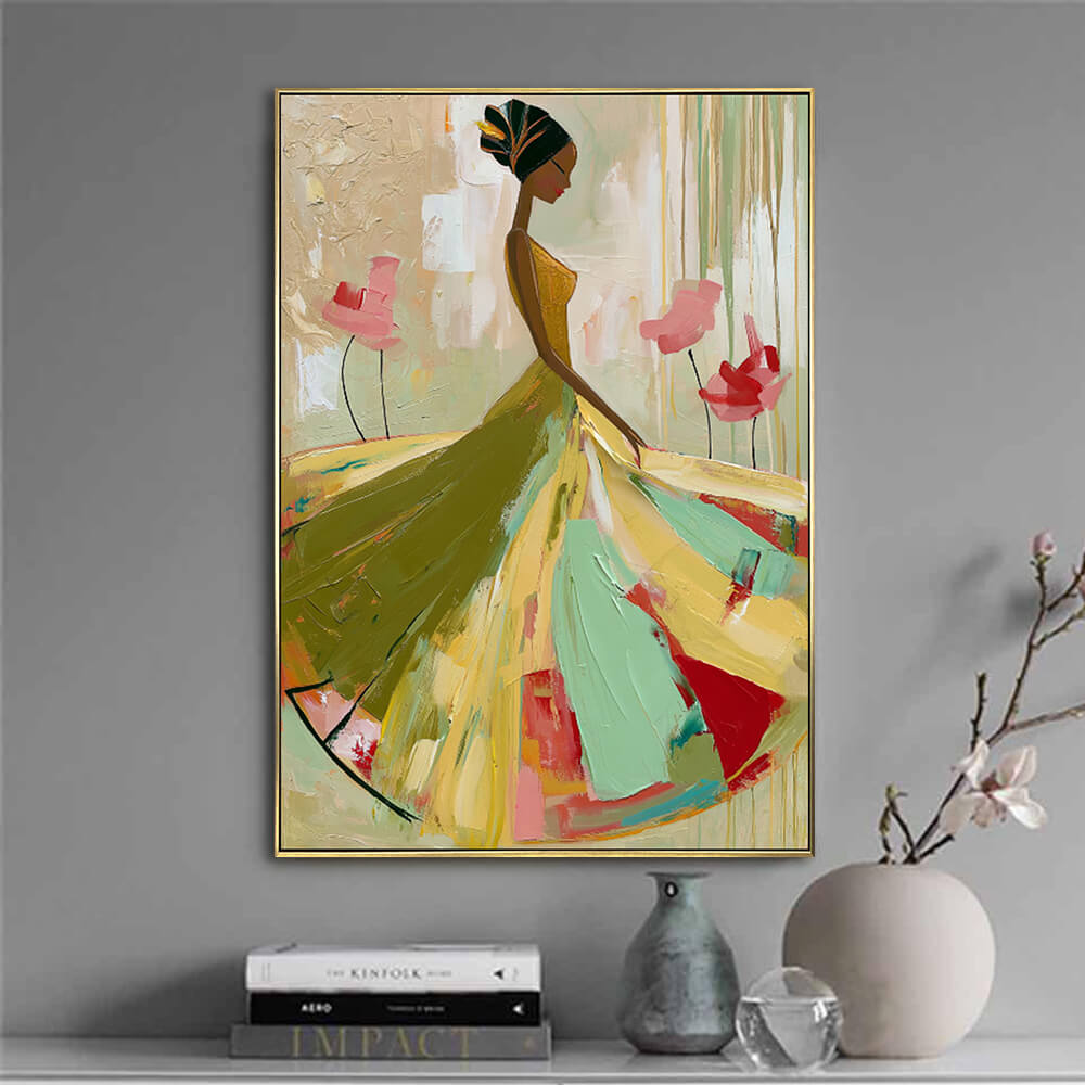 Interior styling view of Ethereal Grace textured gown painting art hanging above a table set with books and a vase.