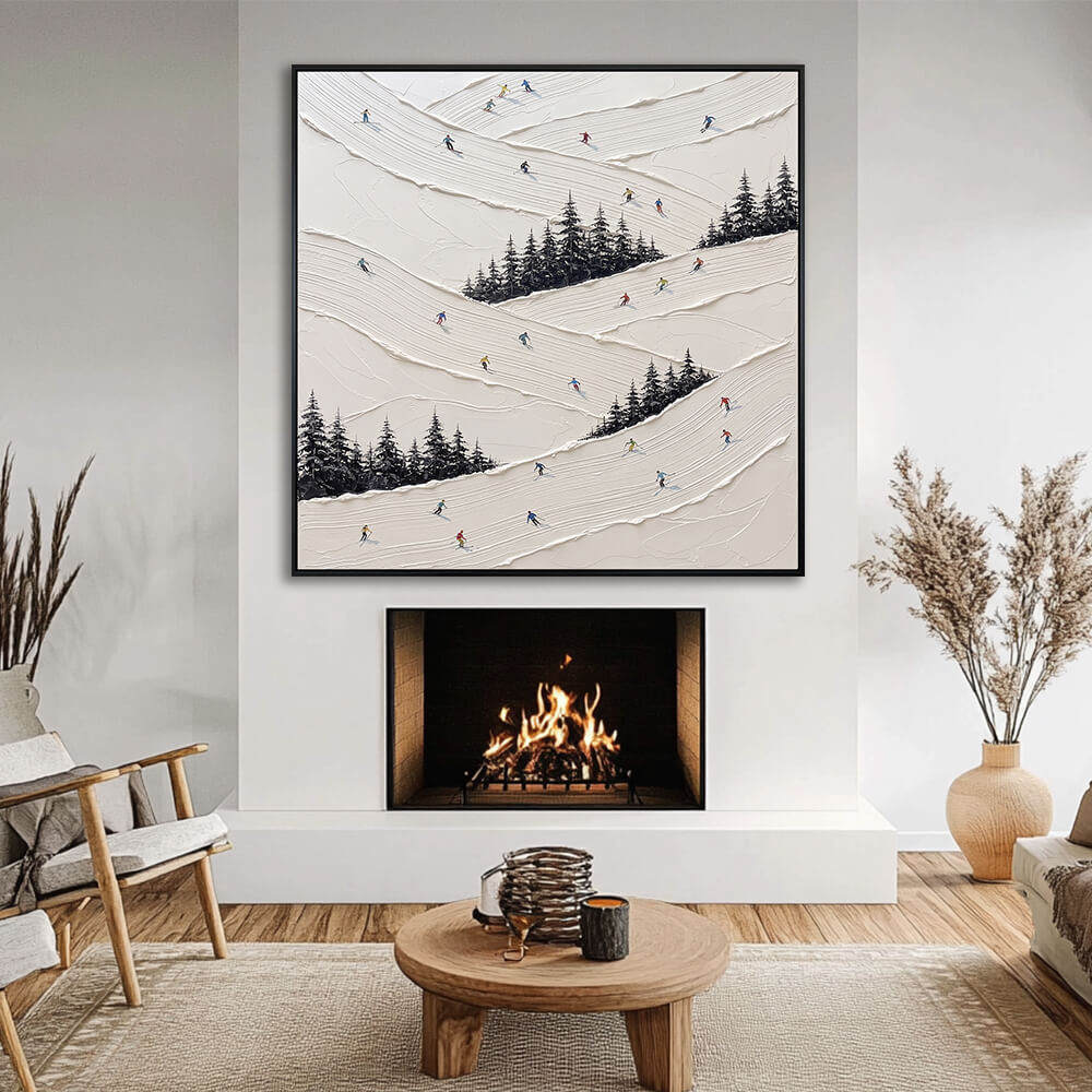 Interior styling view of Snowy Slalom textured snow slalom art hanging above a glowing fireplace in a cozy, cream-toned living room.