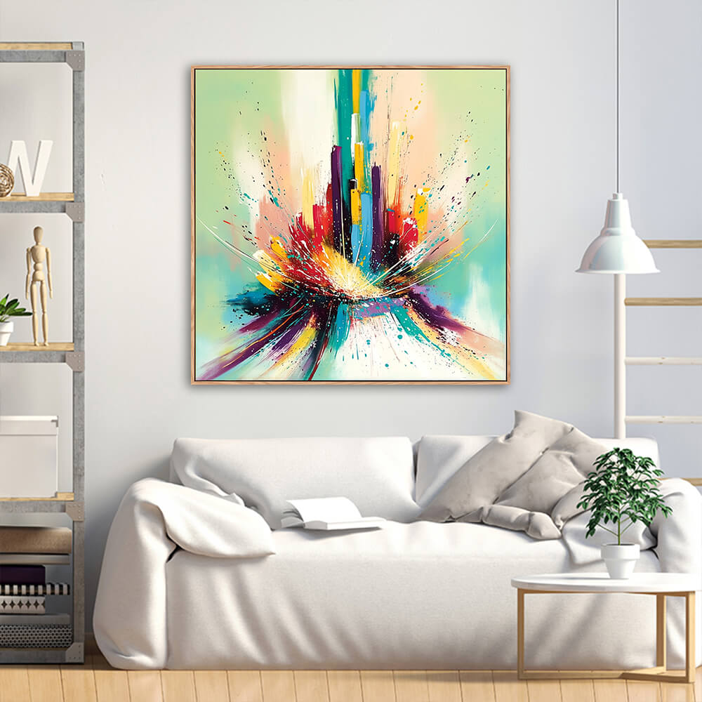 Hand-painted colorful city skyline abstract canvas displayed above soft white linen sofa with industrial metal wood shelf and green foliage plant in bright living room
