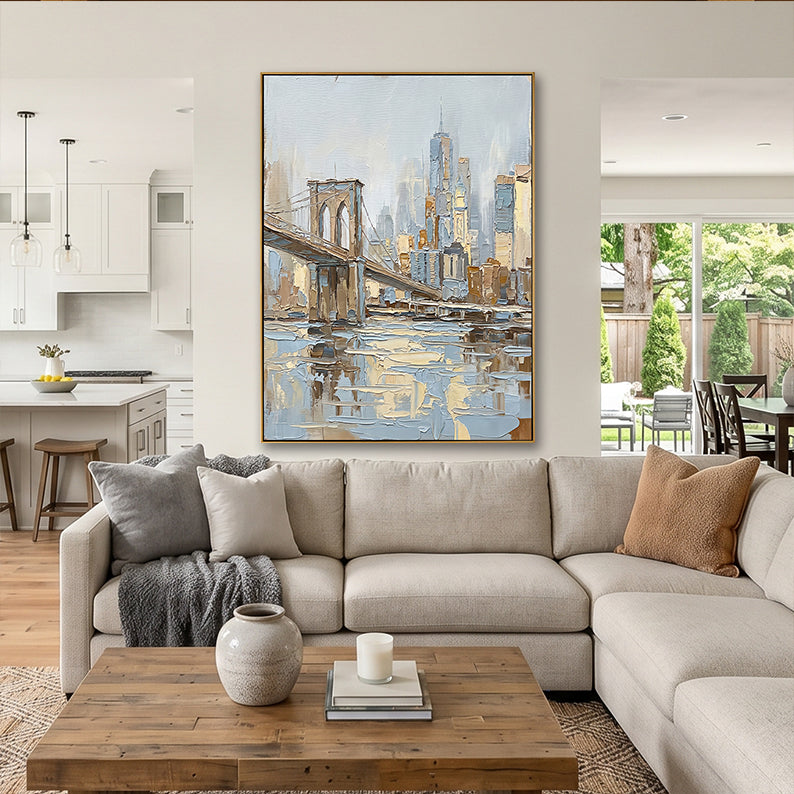 Modern open-concept living space and kitchen featuring a large Brooklyn Bridge textured painting.