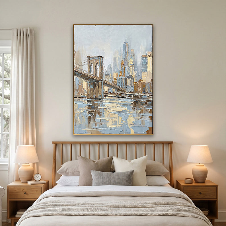 Minimalist bedroom interior featuring a large hand-painted NYC cityscape above a bed with neutral linens.