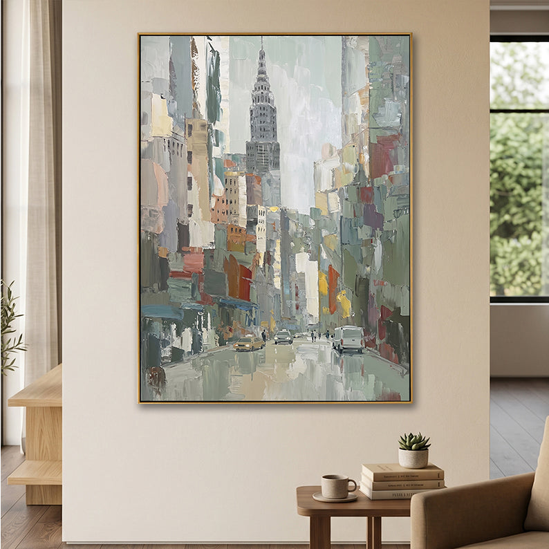 Close-up of an abstract Chrysler Building painting in a sunlit modern entryway.