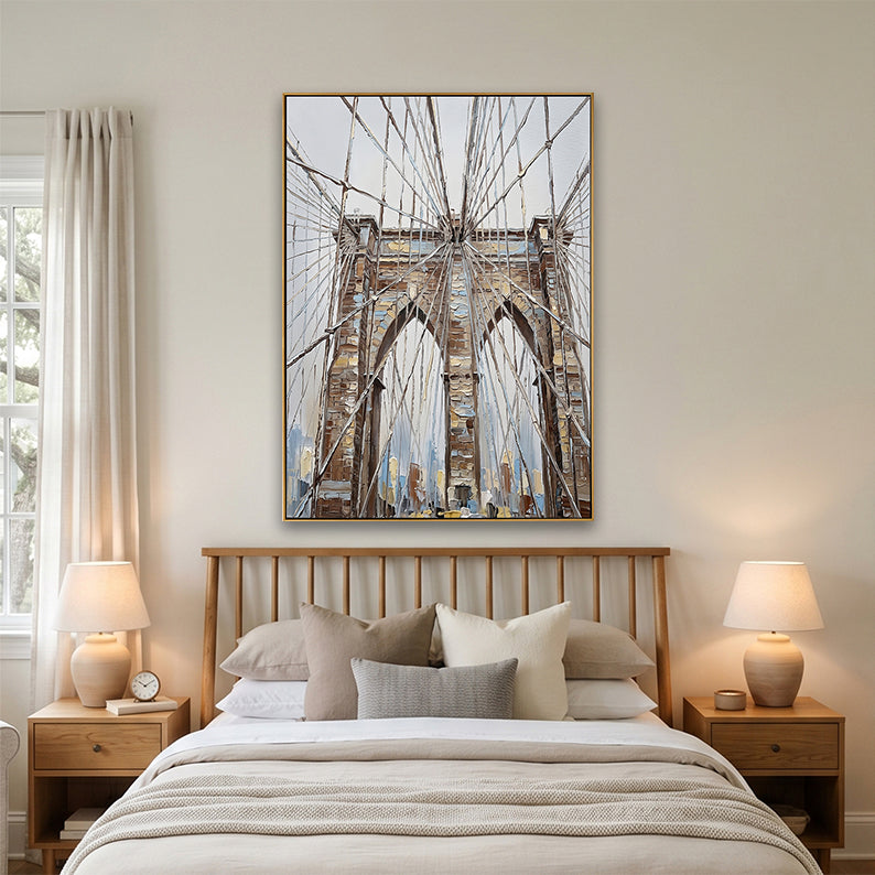 Minimalist bedroom interior featuring a large vertical Brooklyn Bridge cityscape above a bed.