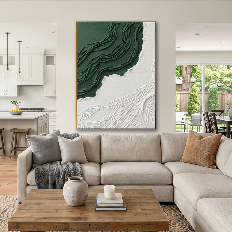 Minimalist green and white sculptural painting featured in a bright open-concept kitchen and lounge area.